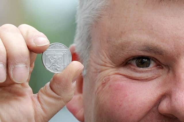 David Allan with the coin.
Picture: Sarah Standing