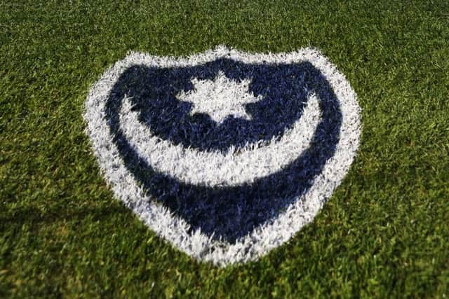 The Pompey badge painted onto the side of the pitch at Fratton Park
