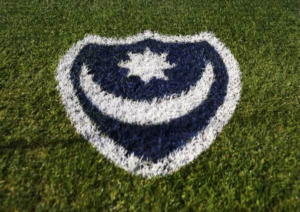 The Pompey badge painted onto the side of the pitch at Fratton Park