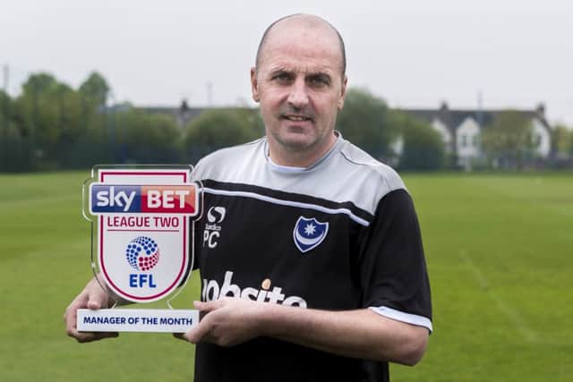 Paul Cook with his League Two manager of the month award. Picture: Jason Brown/JMP