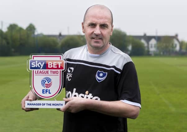 Paul Cook with his League Two manager of the month award. Picture: Jason Brown/JMP