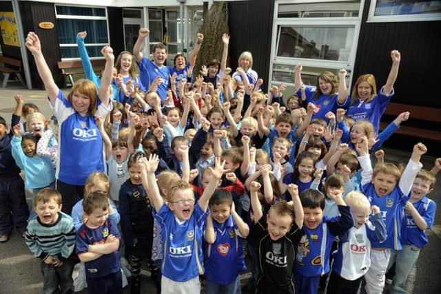 Children at Corpus Christi Primary School in Portsmouth at the first Blue Day in 2008