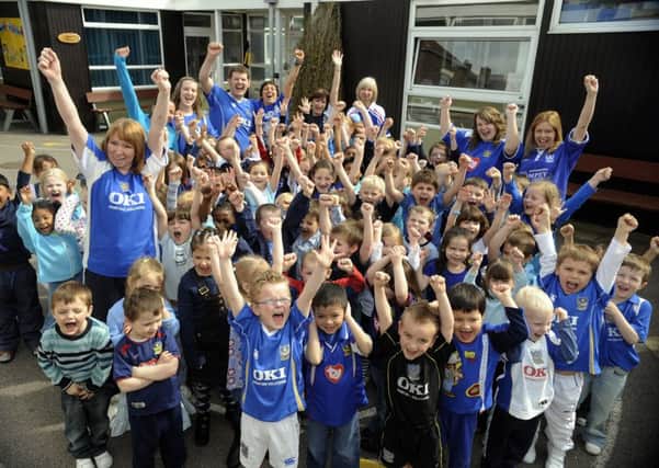 Children at Corpus Christi Primary School in Portsmouth at the first Blue Day in 2008