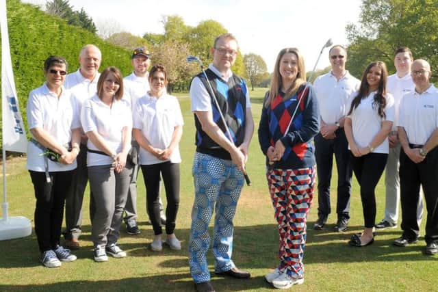 Pictured is: (middle l-r) Chris Green from the Property Search Group and Sam Marsh from Biscoes Solicitors with staff from McAndrew Martin.Picture: Sarah Standing (170552-6548)