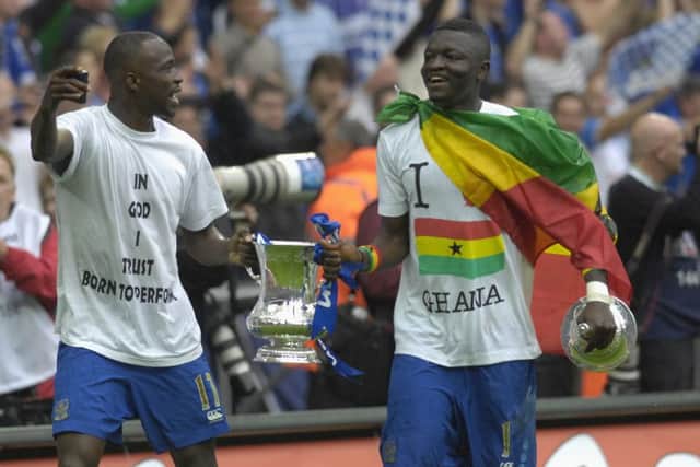 Sulley Muntari and John Utaka with the FA Cup. Picture: Will Caddy