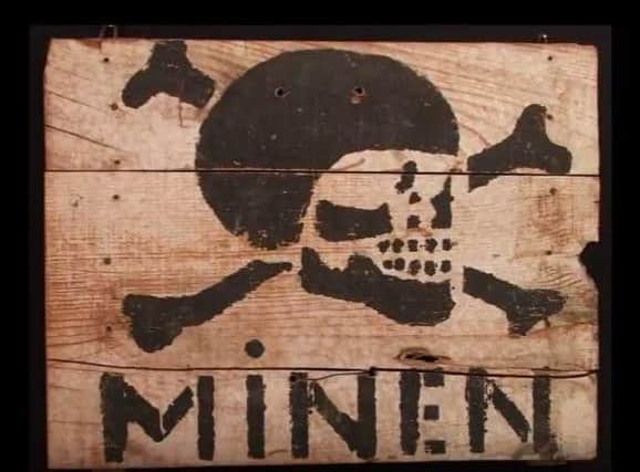 The German minefield sign at the D-Day Museum