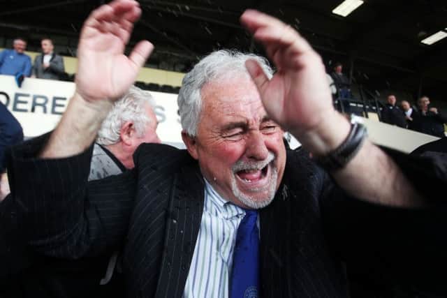 Chairman Iain McInnes at the centre of the Pompey celebrations after promotion from League Two was confirmed following victory against Notts County at Meadow Lane