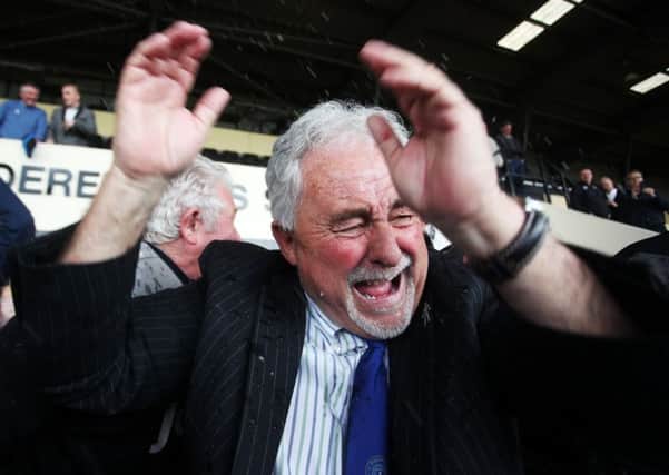 Chairman Iain McInnes at the centre of the Pompey celebrations after promotion from League Two was confirmed following victory against Notts County at Meadow Lane