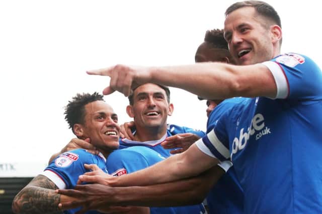 The Pompey players celebrate their title win Picture: Joe Pepler