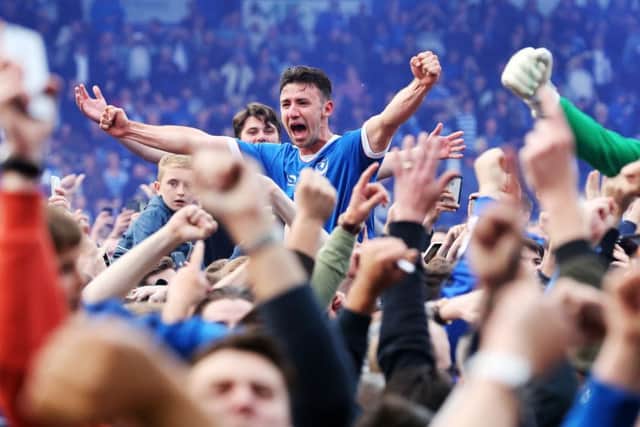 Enda Stevens is carried aloft by Blues fans on the pitch Picture: Joe Pepler