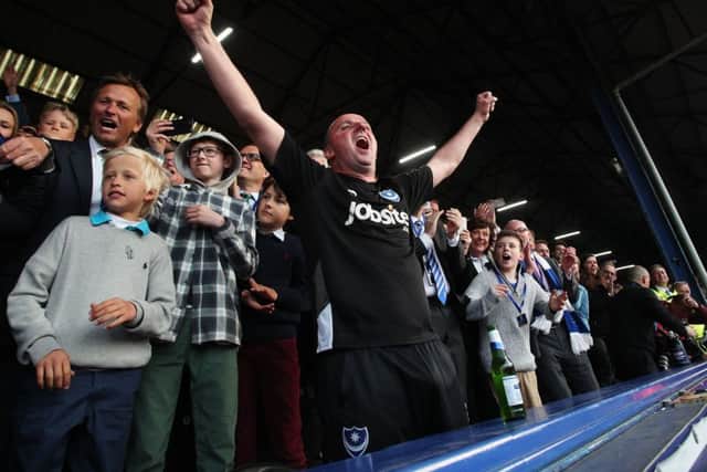 Pompey boss Paul Cook celebrates the Blues' promotion Picture: Joe Pepler