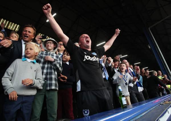 Pompey boss Paul Cook celebrates the Blues' promotion Picture: Joe Pepler