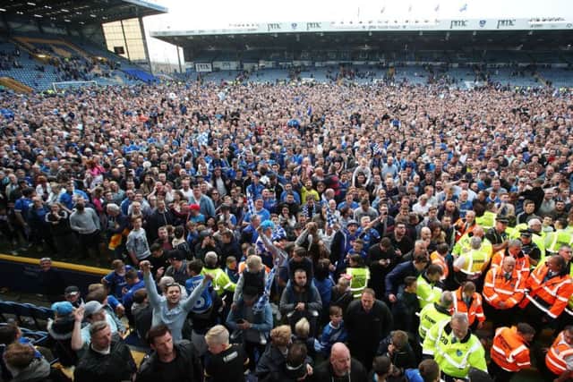 Fans invade Fratton Park at the final whistle. Picture: Joe Pepler