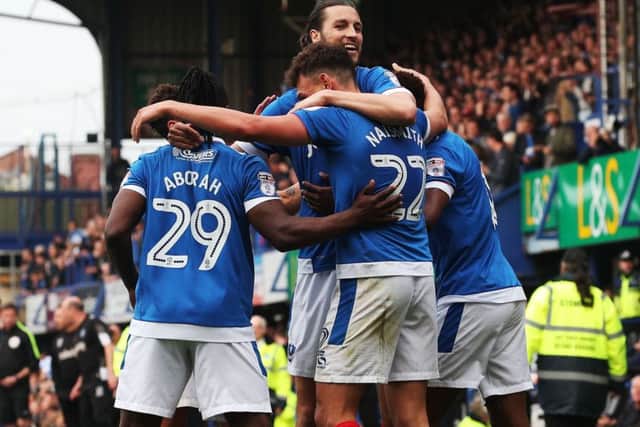 Pompey celebrate one of Kal Naismith's goals in the 6-1 win Picture: Joe Pepler