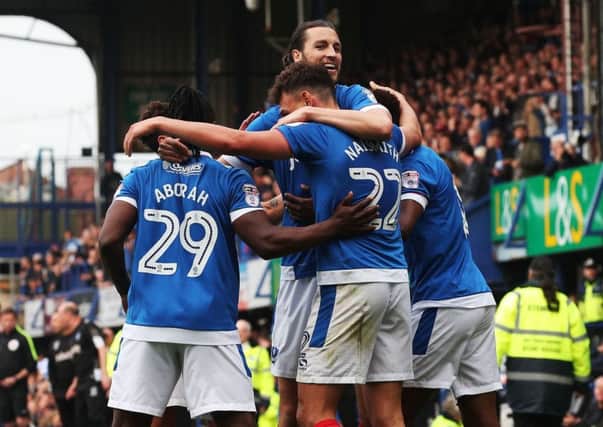 Pompey celebrate one of Kal Naismith's goals in the 6-1 win Picture: Joe Pepler