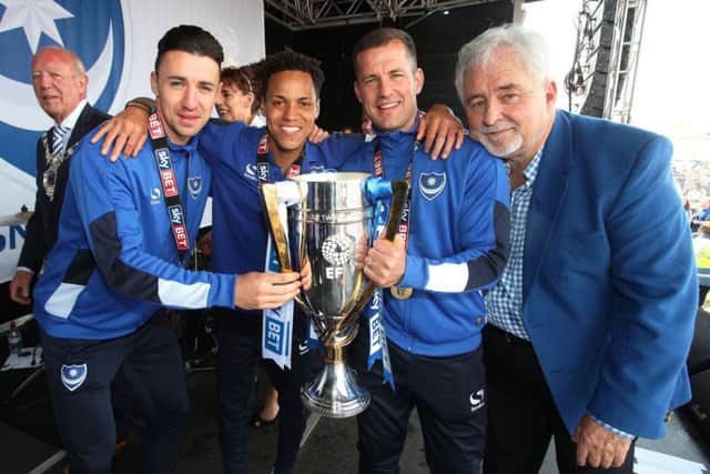 Enda Stevens, Kyle Bennett, Michael Doyle and Iain McInnes with the League Two title down on Southsea Common Picture: Joe Pepler