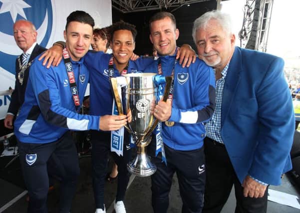 Enda Stevens, Kyle Bennett, Michael Doyle and Iain McInnes with the League Two title down on Southsea Common Picture: Joe Pepler