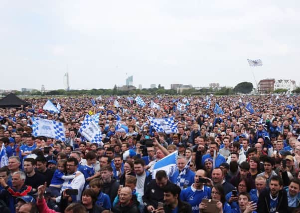 Pompey fans celebrating the club winning the League Two title on Southsea Common today. Picture: Joe Pepler.