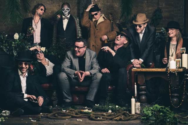 Alabama 3 - Larry Love reclining on the sofa