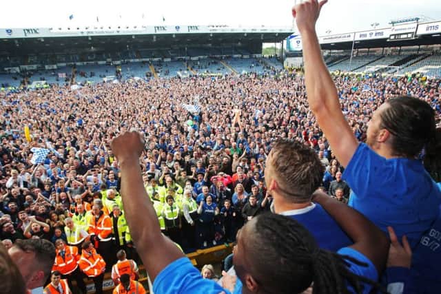Pompey celebrate dramatically winning the League Two title Pic: Joe Pepler