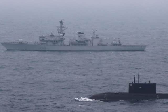Ministry of Defence photo of HMS Somerset escorting a Russian submarine through the English Channel