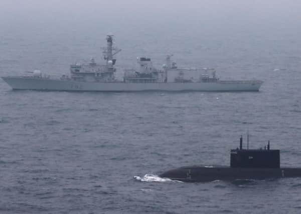 Ministry of Defence photo of HMS Somerset escorting a Russian submarine through the English Channel