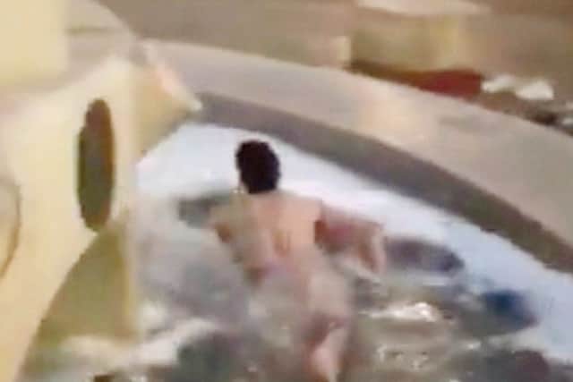 Joe Brindley doing the swim around the fountain