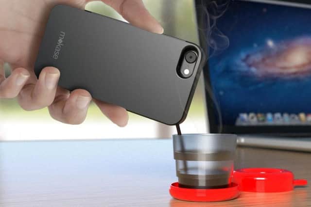 The phone case holds a cup of espresso