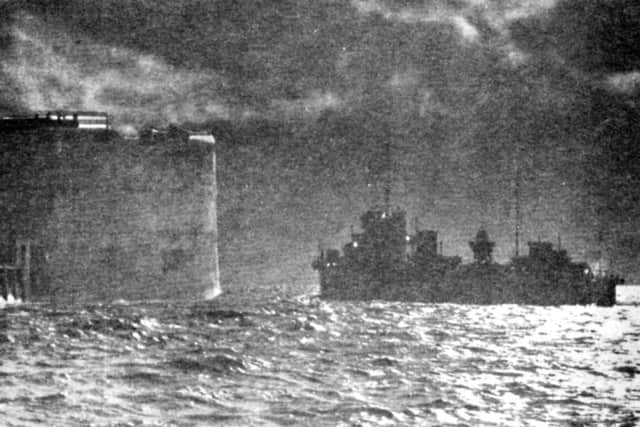 HMS Fury passes the Round Tower in Portsmouth harbour taking the Duke of Windsor into exile shortly after 2am on December 11, 1936