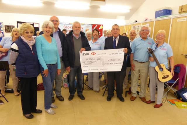 Members of the Stokes Bay Strummers with Adrian Groves from ICANGO