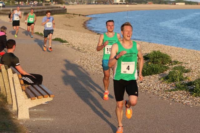 Rob Arkell moves clear of Lewis Banner in the Gosport 5k Series opening race. Picture: David Brawn