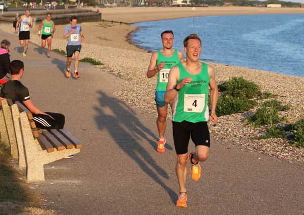 Rob Arkell moves clear of Lewis Banner in the Gosport 5k Series opening race. Picture: David Brawn