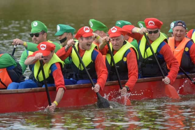 15/5/16
Portsmouth Dragon Boat Festival at 1000 Lakeside. Pictured is the Should Have Had an Outboard team
Picture: Paul Jacobs (160252-5) PPP-160515-163107006