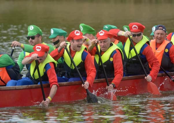 15/5/16

Portsmouth Dragon Boat Festival at 1000 Lakeside. Pictured is the Should Have Had an Outboard team

Picture: Paul Jacobs (160252-5) PPP-160515-163107006