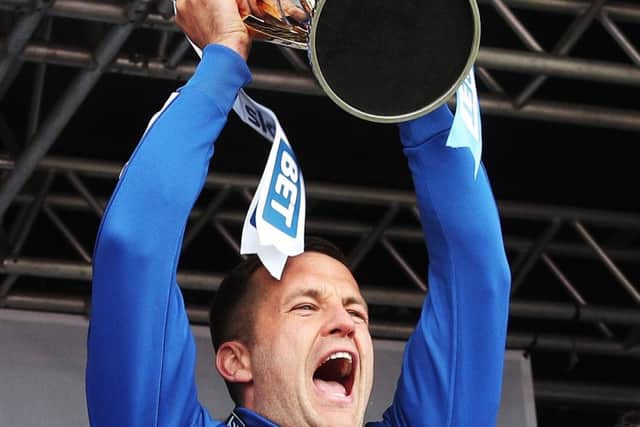 Michael Doyle lifts the trophy  Picture: Joe Pepler