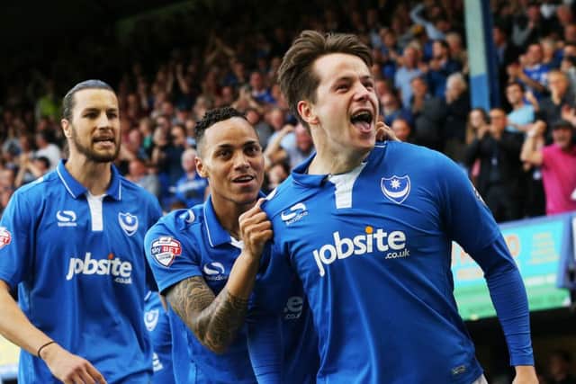 Marc McNulty celebrates scoring against Plymouth Argyle at Fratton Park with Kyle Bennett and Christian Burgess. Picture: Joe Pepler