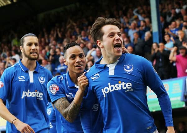 Marc McNulty celebrates scoring against Plymouth Argyle at Fratton Park with Kyle Bennett and Christian Burgess. Picture: Joe Pepler