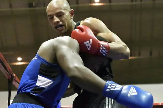 Greg Bridet takes on Nikosilath Ngwenya Picture: Neil Marshall
