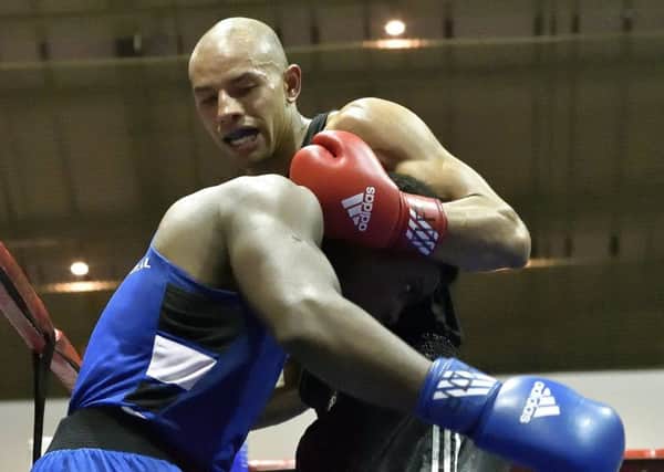 Greg Bridet takes on Nikosilath Ngwenya Picture: Neil Marshall