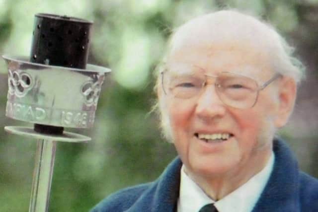 Lt Cdr Clark who used the Olympic flame to light the boiler of HMS Whitesand Bay