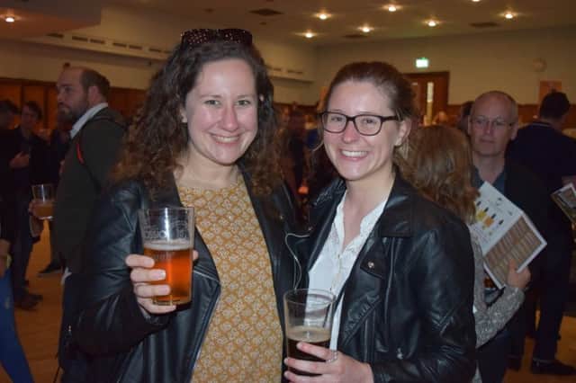 Stefany Guala, 25, and Angela Norman, 26 who live in Southsea,, enjoy their first POrtsmouth Beer Festival. Picture by Loughlan Campbell