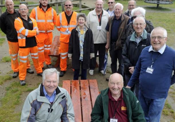 New picnic tables have been installed at Bidbury Mead after the original tables which had been part of a recent revamp were vandalised. Front left, Ron Tate and Steve Sadler of Bidbury Mead Friends lead the celebrations. Picture Ian Hargreaves  (170608-1) PPP-171205-181715006