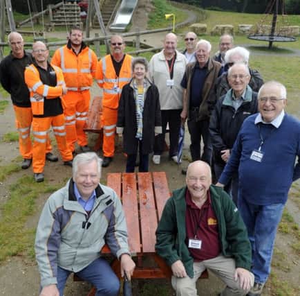 New picnic tables have been installed at Bidbury Mead after the original tables which had been part of a recent revamp were vandalised. Front left, Ron Tate and Steve Sadler of Bidbury Mead Friends lead the celebrations.
 Picture Ian Hargreaves  (170608-1) PPP-171205-181715006