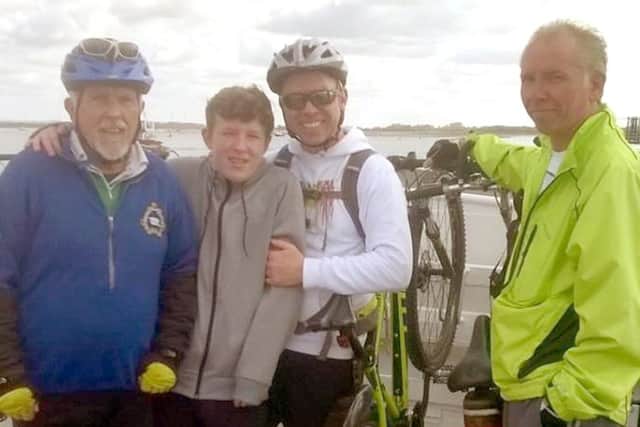 From left: Derek Cousins, his grandson Morgan Cousins-White, and sons Owen Phelps-Cousins and Darren Cousins
