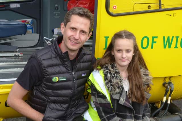 Maisie Godden-Hall with Chris Hill from the Hampshire and Isle of Wight Air Ambulance who helped after her accident