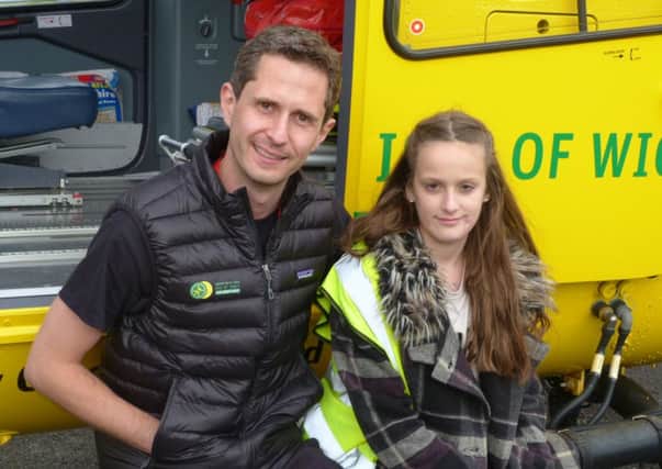 Maisie Godden-Hall with Chris Hill from the Hampshire and Isle of Wight Air Ambulance who helped after her accident