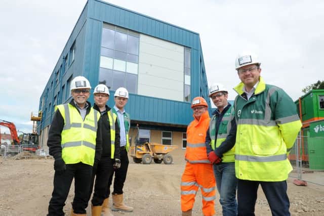 Members of the team at the Portsmouth UTC construction site in Hilsea - from left: Andy Newman, design manager; Luke Heathcote, design manager; Lewis Bugden, trainee quantity surveyor; Pete Roberts, traffic marshall; Brett Younger, senior site manager and Matt Crookes, project manager Picture: Sarah Standing (170556-6708)