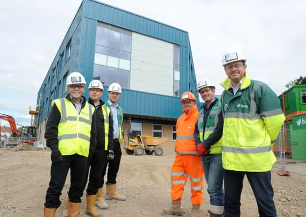Members of the team at the Portsmouth UTC construction site in Hilsea - from left: Andy Newman, design manager; Luke Heathcote, design manager; Lewis Bugden, trainee quantity surveyor; Pete Roberts, traffic marshall; Brett Younger, senior site manager and Matt Crookes, project manager Picture: Sarah Standing (170556-6708)