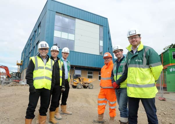 Members of the team at the Portsmouth UTC construction site in Hilsea - from left:  Andy Newman, design manager; Luke Heathcote, design manager; Lewis Bugden, trainee quantity surveyor; Pete Roberts, traffic marshall; Brett Younger, senior site manager and Matt Crookes, project manager                                              Picture: Sarah Standing (170556-6708)