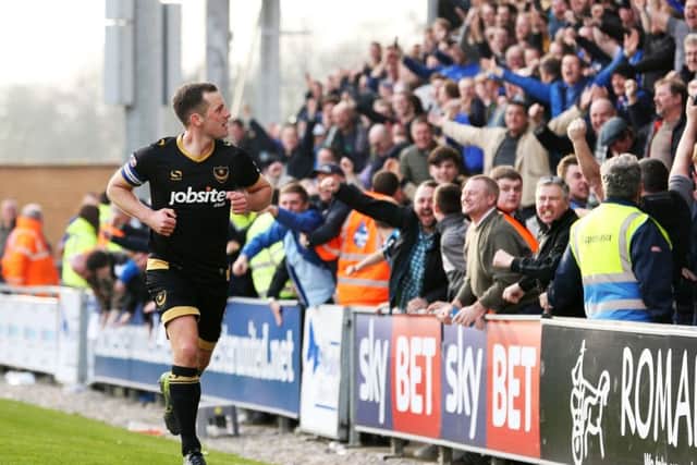 Michael Doyle celebrates scoring against Colchester. Picture: Joe Pepler